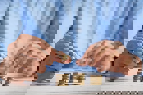 Coins stacked in 3 piles